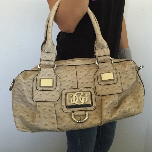 Tan Guess Purse. GUESS womens Noelle Small Elite Tote, Coal, One Size US.